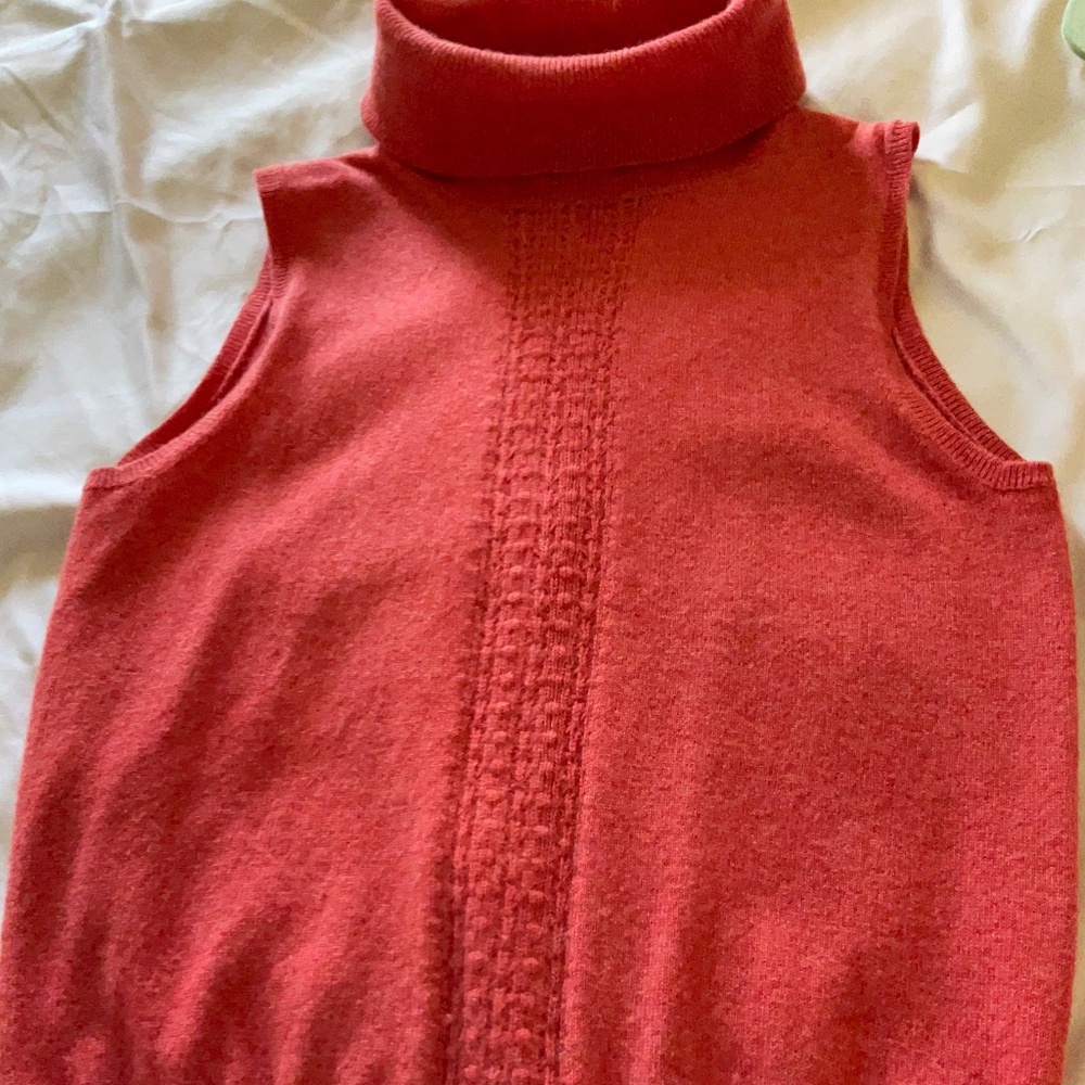 Cashmere salmon colored sleeveless sweater.